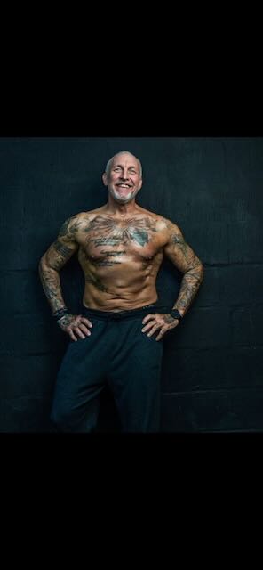 Trainer demonstrating standing movement